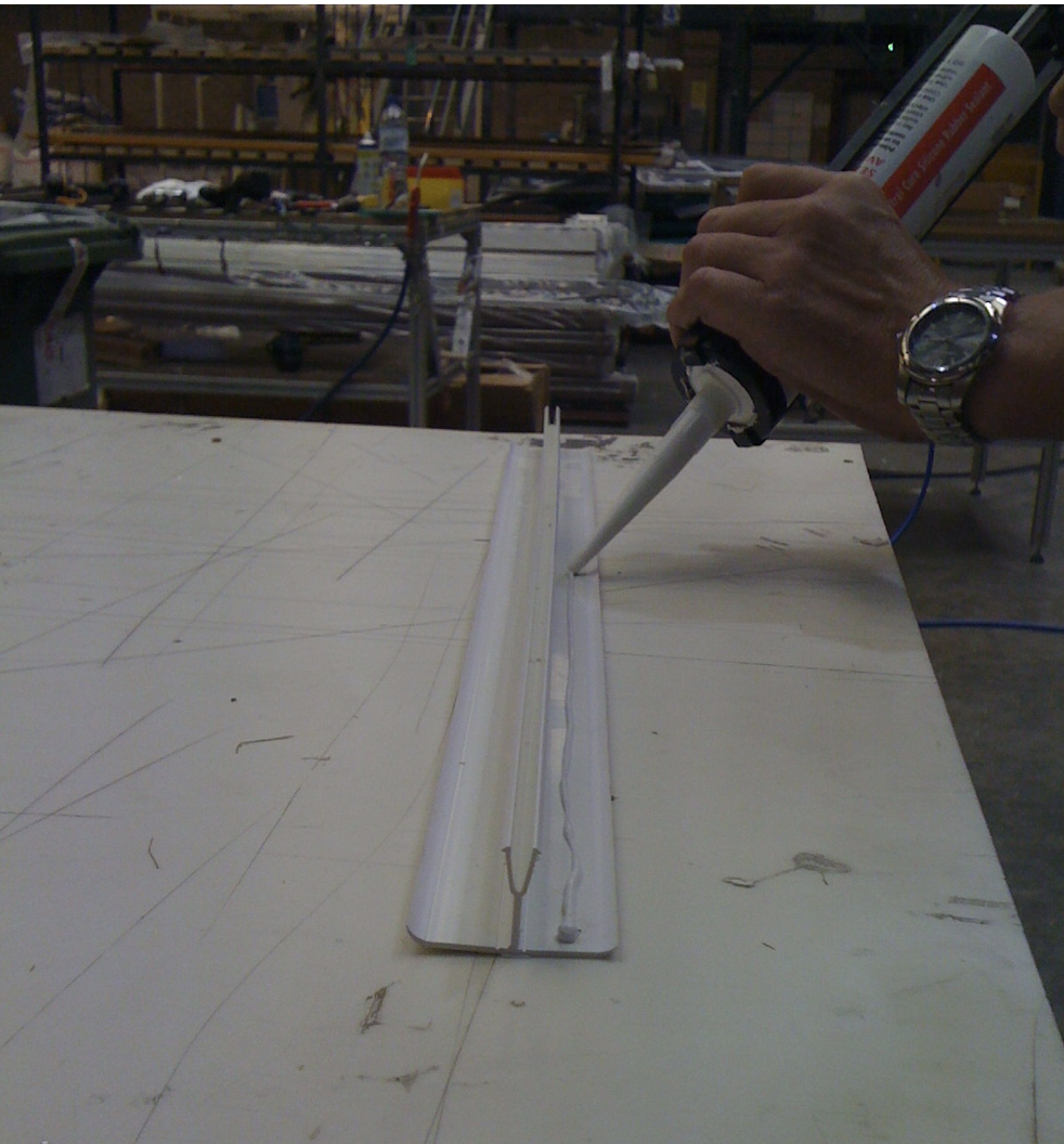 Application of silicone along both sides of the PVC connector cap